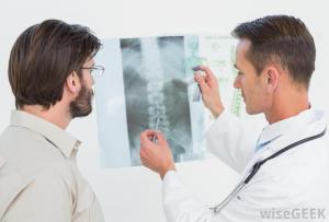 doctor-and-patient-looking-at-spine-xray